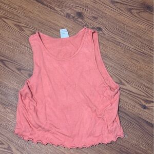 Coral Sleeveless Top with Ruffled Hem